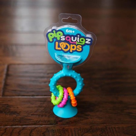 Прорізувач-брязкальце на присосках Fat Brain Toys pipSquigz Loops бірюзовий F166ML Прорізувач-брязкальце на присосках Fat Brain Toys pipSquigz Loops бірюзовий F166ML